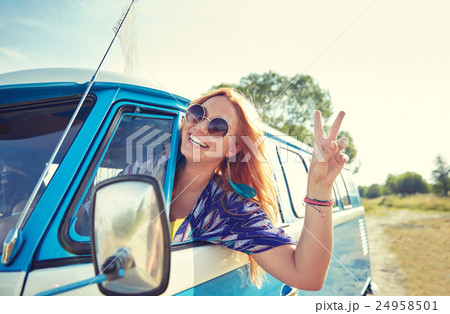 smiling young hippie woman driving minivan car 24958501