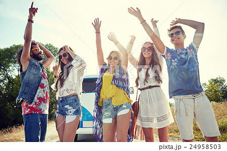 happy young hippie friends dancing outdoors 24958503