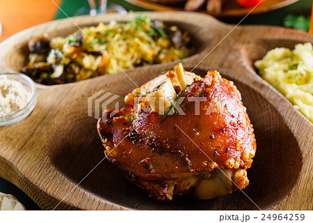 eisbein with braised cabbage, salad and beer 24964259