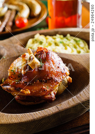 eisbein with braised cabbage, salad and beer 24964260