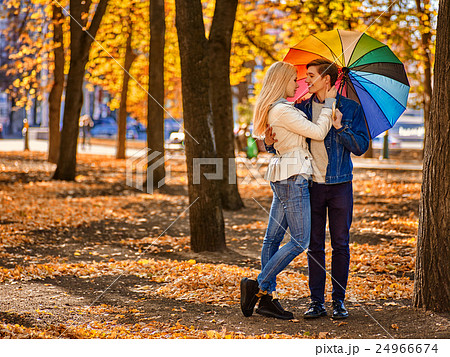 Young couple hugging and flirting in park. 24966674