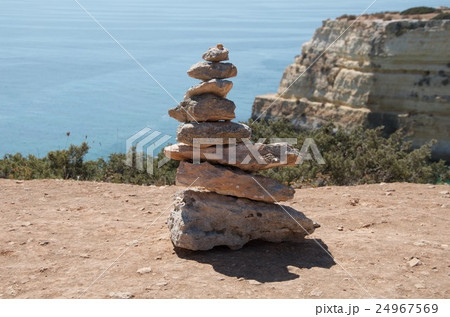 Stone pyramid at the sea Stone pyramid at the sea 24967569