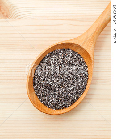 Nutritious chia seeds in wooden spoon. Nutritious chia seeds in wooden spoon. 24968508