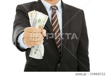 businessman holding a handful of us dollars 24969722