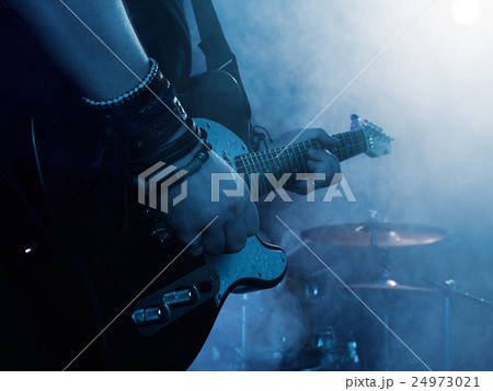 Silhouette of guitar player on stage. Silhouette of guitar player on stage. 24973021