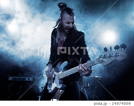 Bassist in the foreground. 24974009