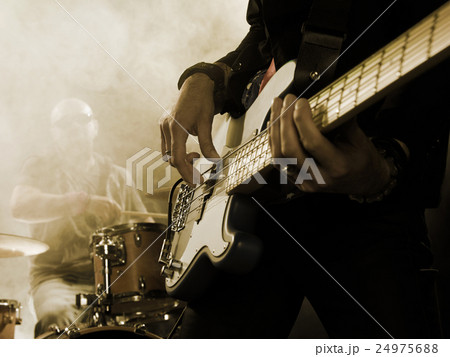 Bassist in the foreground. 24975688