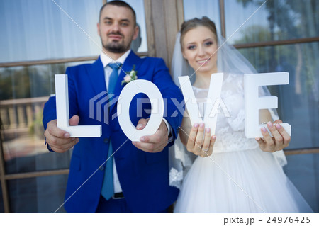 Newlyweds on a walk in the countryside Newlyweds on a walk in the countryside 24976425