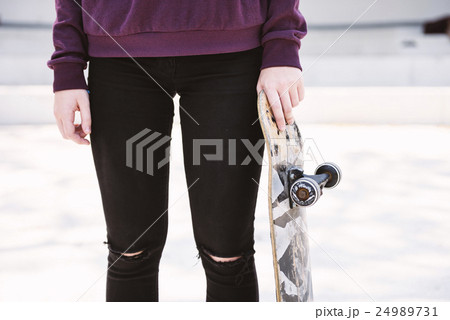 Young Woman Skater Walking Active Concept 24989731