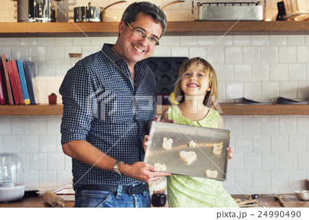 Family Father Girl Making Cookies Learning Baking Concept 24990490