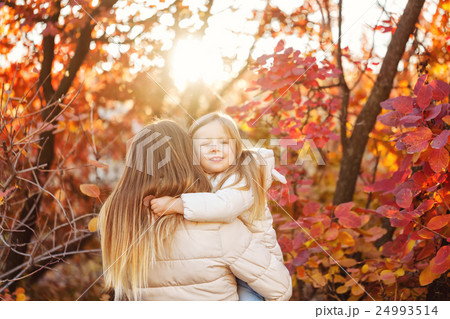 Cute family hug. Autumn. Sunset. Cute family hug. Autumn. Sunset. 24993514