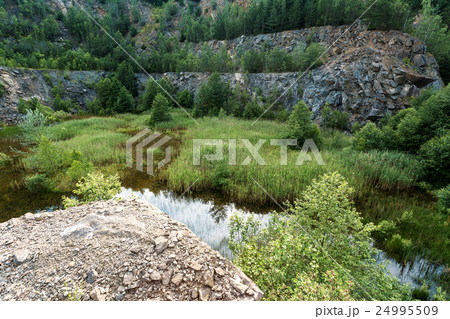abandoned flooded quarry, Czech republic abandoned flooded quarry, Czech republic 24995509