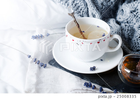 Warm knitted sweater,cup of hot tea 25008335
