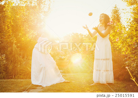 Two sisters and a basket of crop Two sisters and a basket of crop 25015591