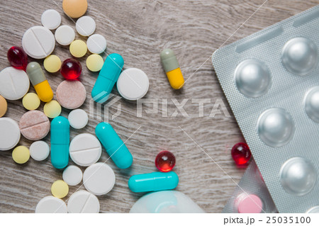 lot of colorful medication, pills and blister pack 25035100