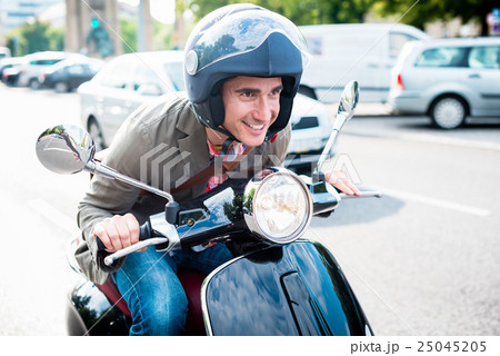 Tourist in Berlin riding scooter 25045205