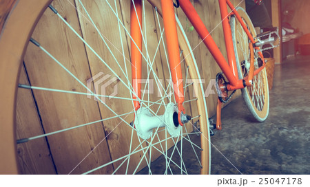 fixed gear bicycle parked with wood wall 25047178