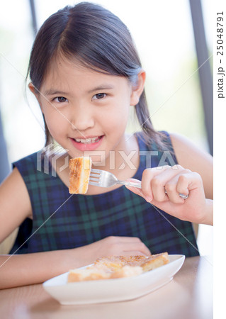 Asian girl enjoy eating Banana split ice-cream 25048791