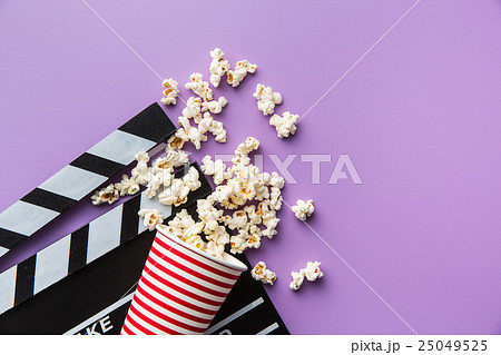 popcorn and clapperboard popcorn and clapperboard 25049525