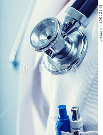 Doctor holding a stethoscope listening heartbeat Doctor holding a stethoscope listening heartbeat 25052545