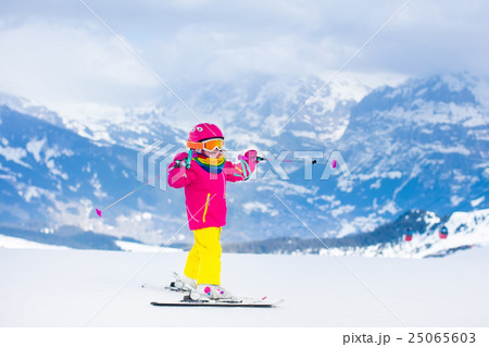 Little child skiing in the mountains Little child skiing in the mountains 25065603