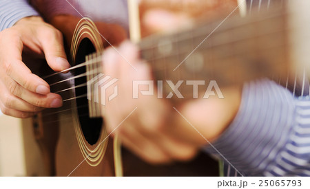 Handsome man playing guitar at home 25065793