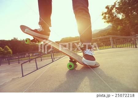 young skateboarder legs skateboarding at skatepark young skateboarder legs skateboarding at skatepark 25072218