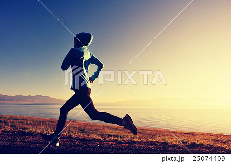young woman runner running on sunrise seaside young woman runner running on sunrise seaside 25074409