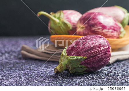 Eggplant varieties in wooden bowl  25086065