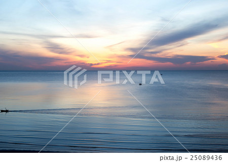 beautiful sunrise with fishing boat in the sea beautiful sunrise with fishing boat in the sea 25089436
