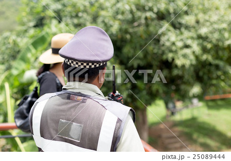Security guard watching for safty of tourist woman 25089444
