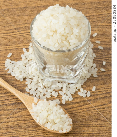 Japanese Rice in Wooden Spoon and Glass Cup 25090884