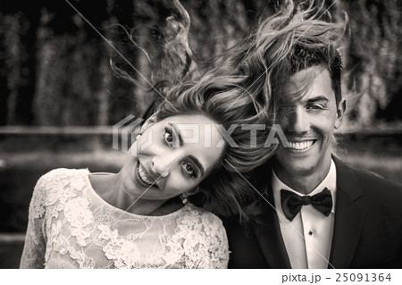 Beautiful bride throws her hair over a  groom 25091364