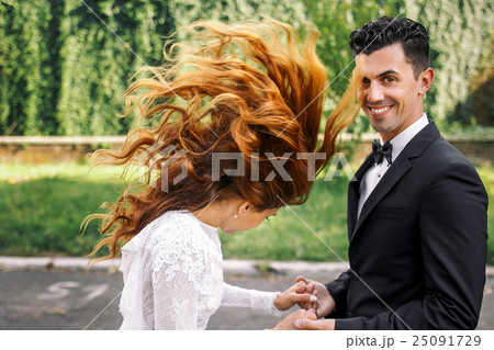 Waves of bride's red hair  25091729