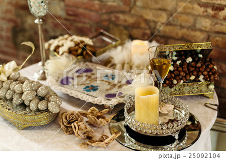 A wineglass stand on a little mirror 25092104