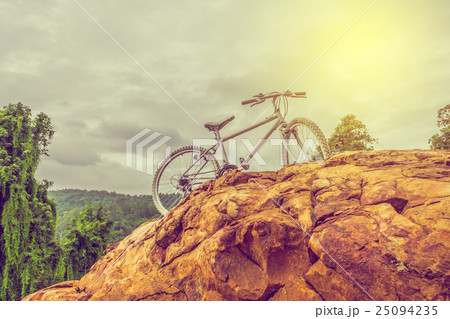bicycle on the top of rock mountain bicycle on the top of rock mountain 25094235