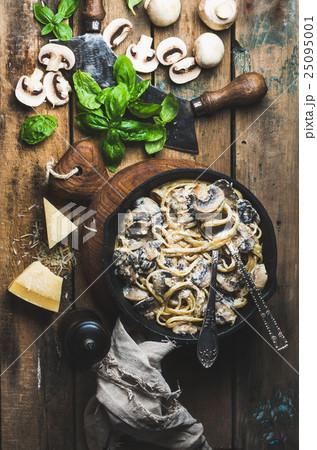 Mushroom pasta spaghetti in iron pan served with 25095001