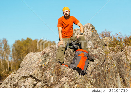 Young male with beard is traveling through the Young male with beard is traveling through the 25104750