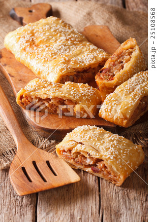 sliced pie stuffed with cabbage and sausages sliced pie stuffed with cabbage and sausages 25108568