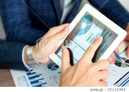Business colleagues working and analyzing Business colleagues working and analyzing 25112465