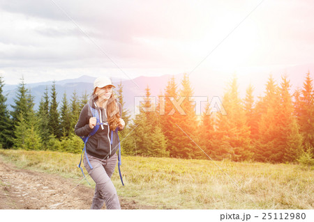 Young backpacker woman enjoying mountain trip 25112980