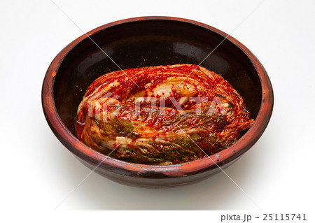 Kimchi in a crock head isolated on white backgroun Kimchi in a crock head isolated on white backgroun 25115741
