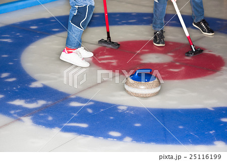 Curling stones on the ice 25116199