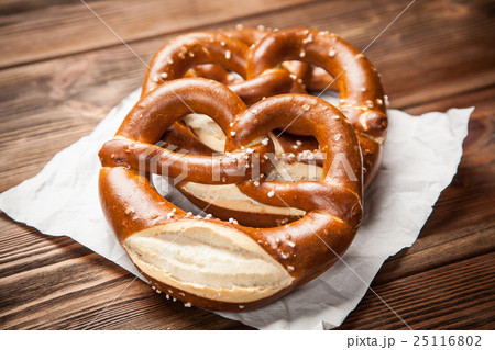 Pretzels on wooden table Pretzels on wooden table 25116802