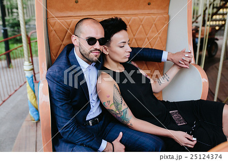 adult man and woman on a carousel adult man and woman on a carousel 25124374