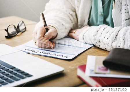 Senior Woman Filling Application Form Documents Concept 25127190