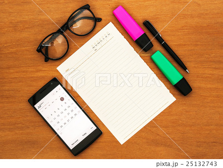 office desk with blank paper note and smart phone office desk with blank paper note and smart phone 25132743