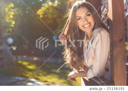 Portrait of smiling young woman, autumn time 25136191