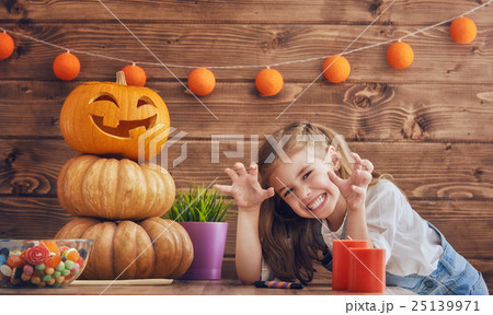 girl with carving pumpkin girl with carving pumpkin 25139971