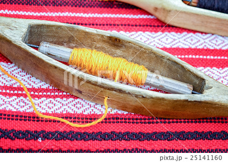 weaving loom and shuttle on the warp. weaving loom and shuttle on the warp. 25141160